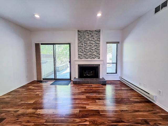 664C Heritage Vlg, Southbury, CT 06488 - unfurnished living room with a baseboard radiator, wood finished floors, a tiled fireplace, recessed lighting, and baseboards