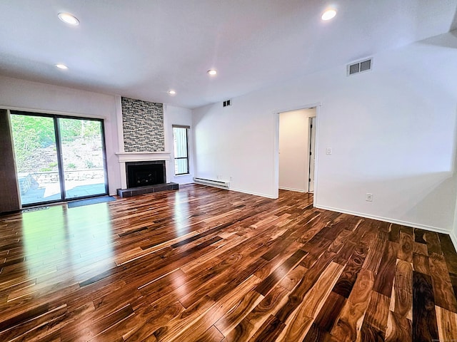 664C Heritage Vlg, Southbury, CT 06488 - unfurnished living room with baseboard heating, wood finished floors, recessed lighting, a large fireplace, and baseboards