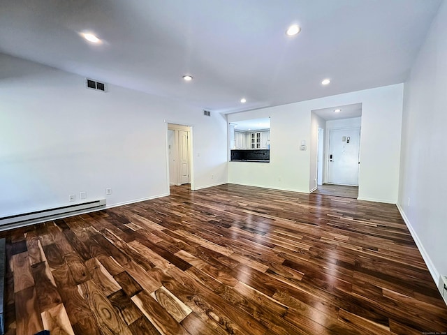 664C Heritage Vlg, Southbury, CT 06488 - unfurnished living room featuring wood finished floors, a baseboard radiator, recessed lighting, and baseboards