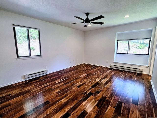 664C Heritage Vlg, Southbury, CT 06488 - unfurnished room featuring baseboard heating, hardwood / wood-style flooring, plenty of natural light, recessed lighting, and a textured ceiling