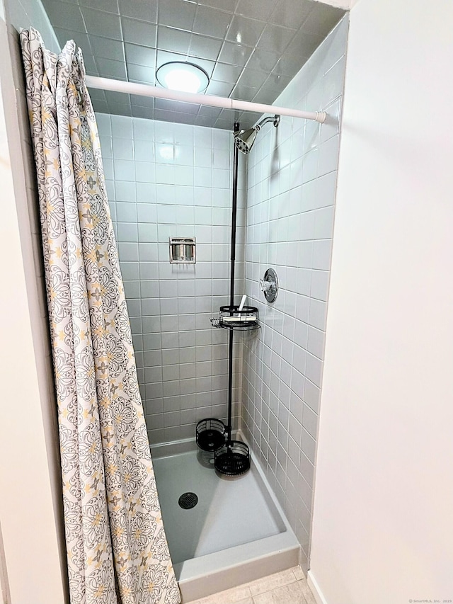 664C Heritage Vlg, Southbury, CT 06488 - full bath featuring tiled shower and tile patterned floors