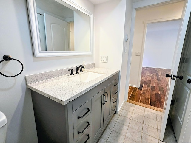 664C Heritage Vlg, Southbury, CT 06488 - bathroom with vanity, baseboards, and wood finished floors