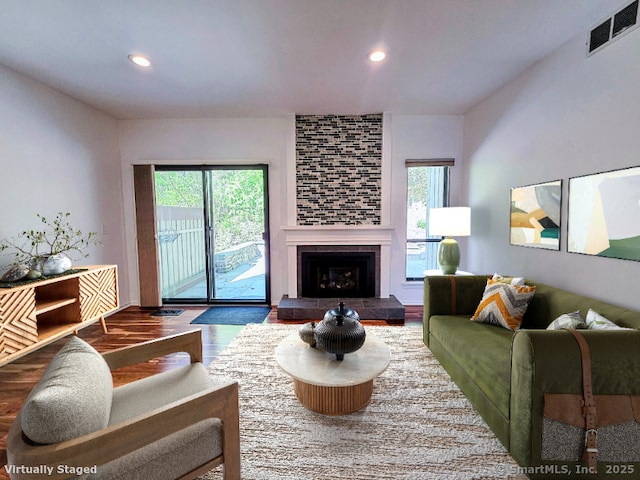 664C Heritage Vlg, Southbury, CT 06488 - living area with healthy amount of natural light, wood finished floors, recessed lighting, and a tiled fireplace