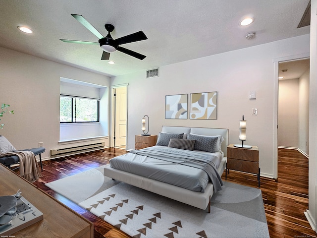 664C Heritage Vlg, Southbury, CT 06488 - bedroom featuring baseboard heating, wood finished floors, ceiling fan, recessed lighting, and baseboards