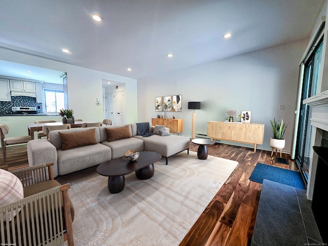 664C Heritage Vlg, Southbury, CT 06488 - living room featuring dark wood-type flooring, recessed lighting, and a fireplace with flush hearth