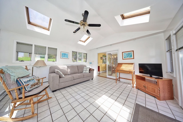 living room with a ceiling fan, lofted ceiling with skylight, a baseboard heating unit, and light tile patterned flooring