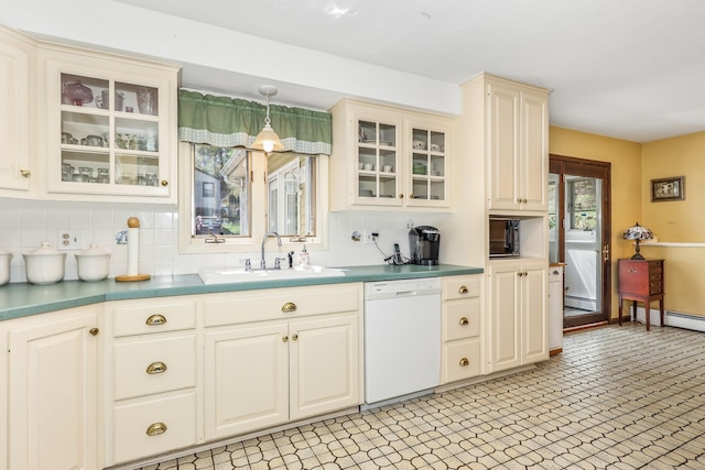 kitchen with decorative backsplash, white dishwasher, a baseboard heating unit, a sink, and a wealth of natural light