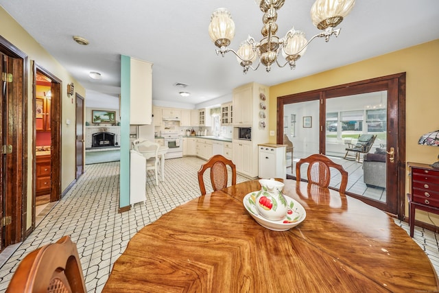 dining room with visible vents and a chandelier