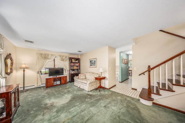 living area with carpet floors, visible vents, baseboards, baseboard heating, and stairway
