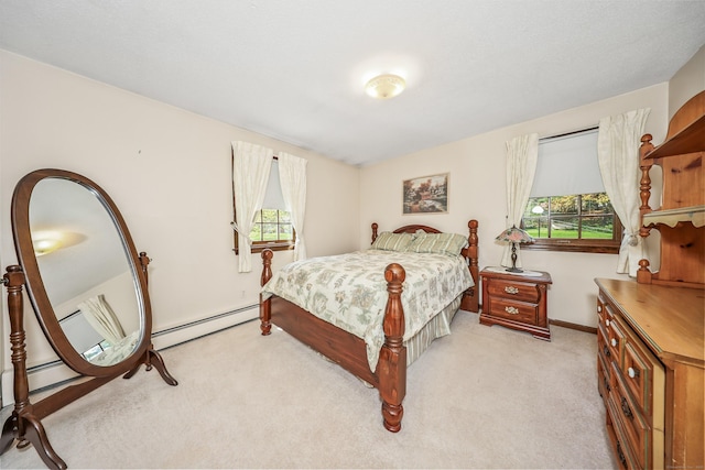 bedroom featuring light colored carpet, a baseboard heating unit, and multiple windows