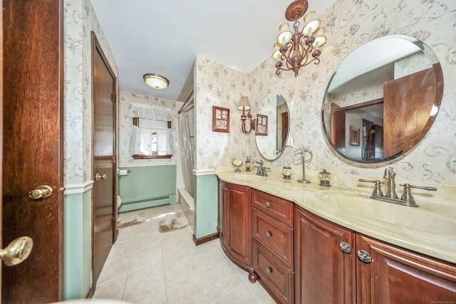 full bathroom with a sink, baseboard heating, double vanity, tile patterned floors, and wallpapered walls