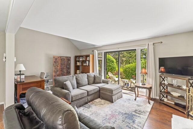 331 Heritage Vlg Unit E, Southbury, CT 06488 - living area featuring wood finished floors and vaulted ceiling