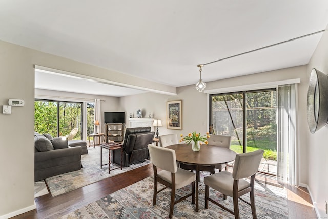 331 Heritage Vlg Unit E, Southbury, CT 06488 - dining room with hardwood / wood-style flooring and baseboards