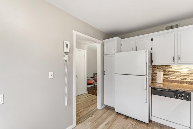 331 Heritage Vlg Unit E, Southbury, CT 06488 - kitchen featuring white appliances, light wood-style flooring, white cabinetry, and decorative backsplash