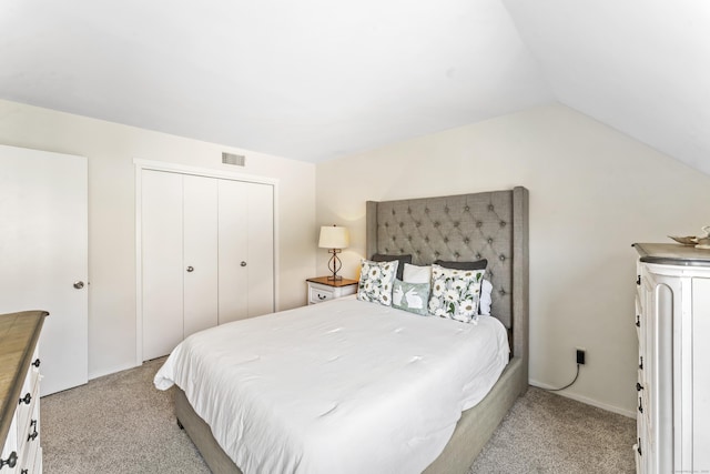 331 Heritage Vlg Unit E, Southbury, CT 06488 - bedroom with light carpet, vaulted ceiling, and a closet