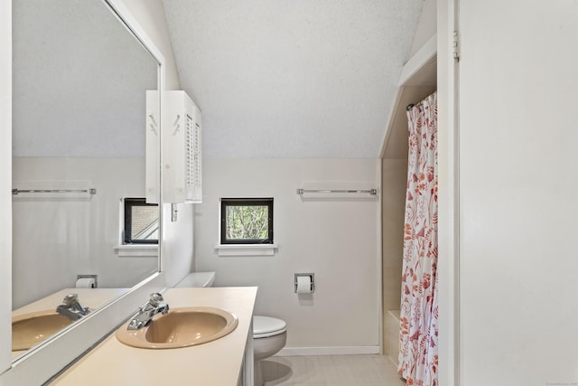 331 Heritage Vlg Unit E, Southbury, CT 06488 - full bathroom featuring toilet, baseboards, vanity, vaulted ceiling, and tile patterned floors