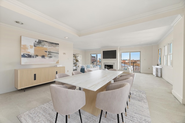 43 Harbor Dr Apt 312, Stamford, CT 06902 - dining room featuring light colored carpet, crown molding, baseboards, a fireplace, and recessed lighting