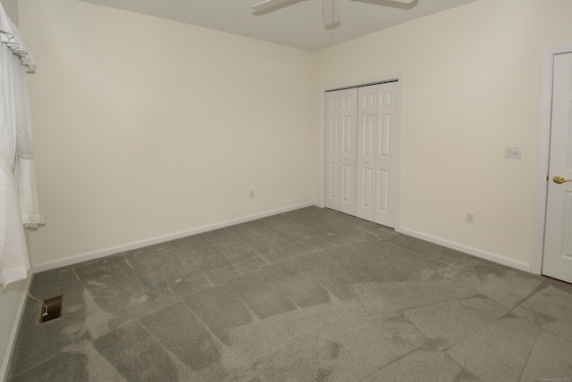unfurnished bedroom featuring carpet floors, baseboards, and visible vents