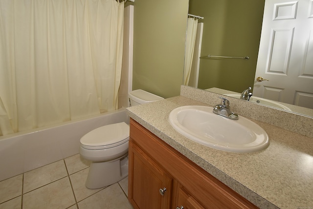 bathroom with vanity, shower / tub combo with curtain, tile patterned floors, and toilet