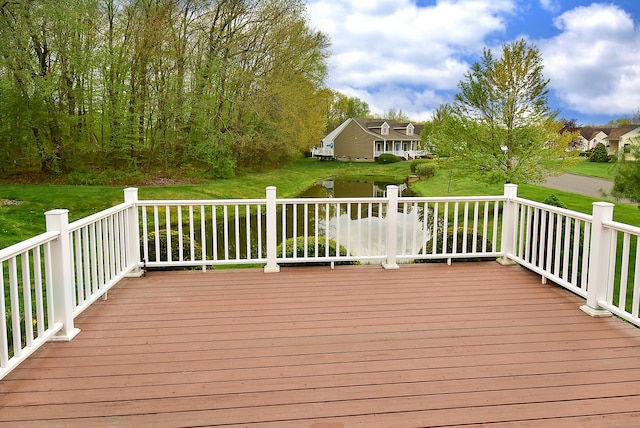 wooden terrace with a yard