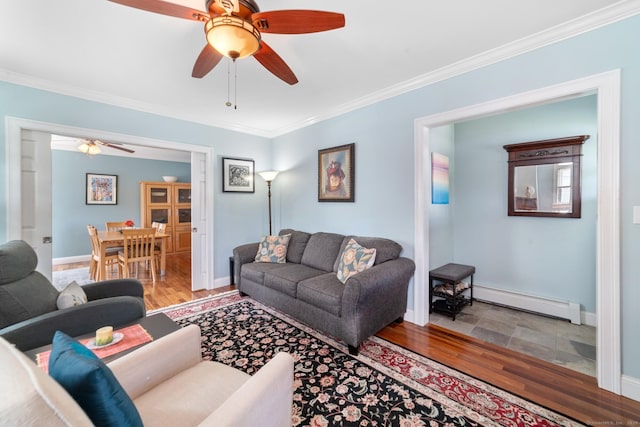 living room featuring crown molding, ceiling fan, and baseboard heating