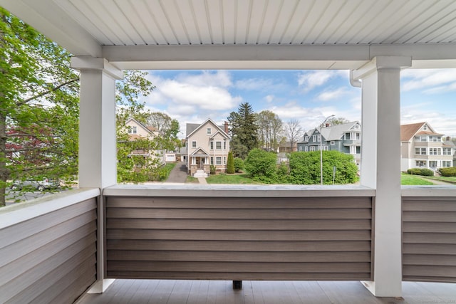 view of patio featuring a residential view and a balcony