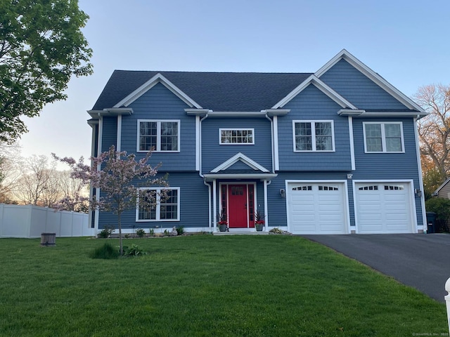 16 Catherine Dr, Wolcott, CT 06716 - view of front of home featuring a garage, fence, driveway, and a front yard