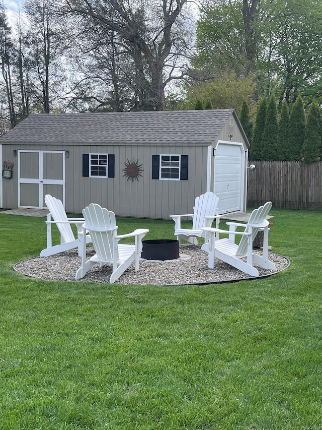 16 Catherine Dr, Wolcott, CT 06716 - view of patio / terrace featuring fence, a fire pit, an outdoor structure, and a shed
