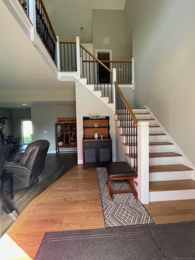 16 Catherine Dr, Wolcott, CT 06716 - stairs featuring a high ceiling, wood finished floors, and visible vents