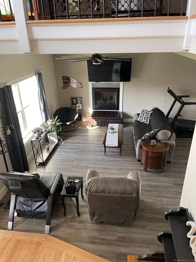16 Catherine Dr, Wolcott, CT 06716 - living room with a fireplace, wood finished floors, and a towering ceiling