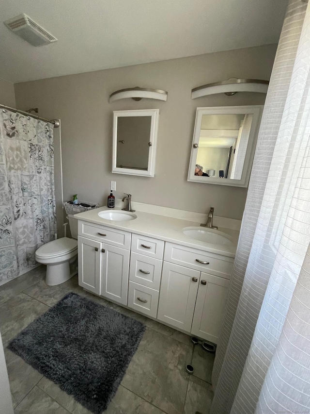 16 Catherine Dr, Wolcott, CT 06716 - bathroom with a sink, toilet, double vanity, and visible vents