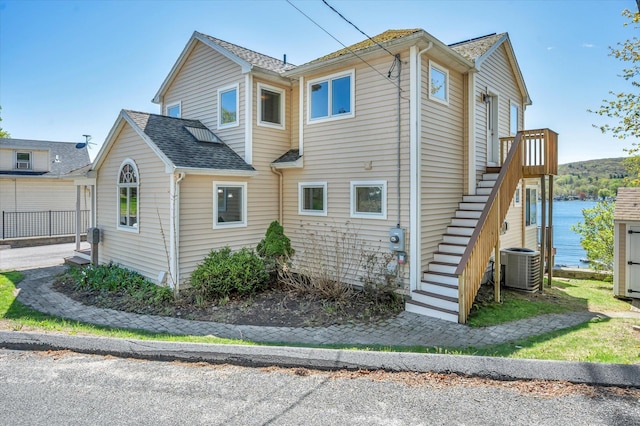 355 W Lake St, Winchester, CT 06098 - view of home's exterior featuring a shingled roof, stairway, and cooling unit