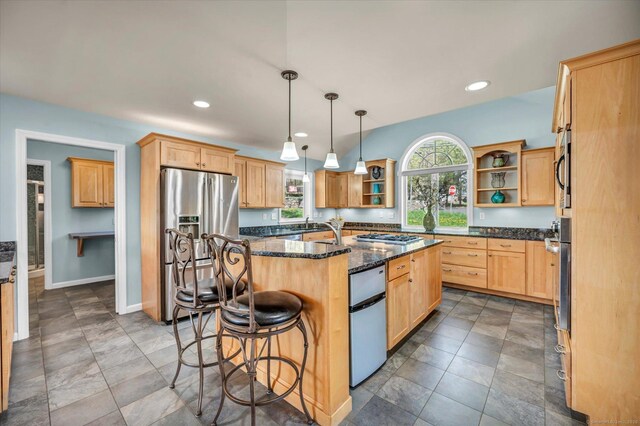 355 W Lake St, Winchester, CT 06098 - kitchen featuring a kitchen breakfast bar, a kitchen island with sink, appliances with stainless steel finishes, open shelves, and light brown cabinets
