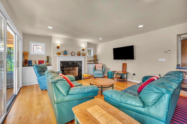355 W Lake St, Winchester, CT 06098 - living room featuring recessed lighting, a fireplace with flush hearth, light wood finished floors, and baseboards