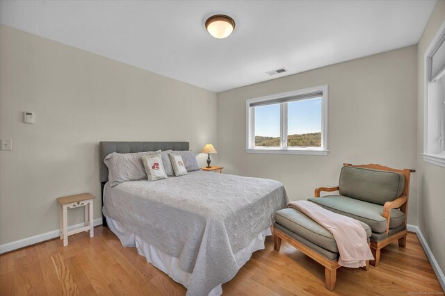 355 W Lake St, Winchester, CT 06098 - bedroom featuring baseboards, visible vents, and light wood-type flooring