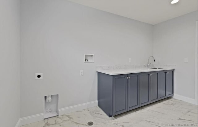 clothes washing area with hookup for an electric dryer, a sink, baseboards, hookup for a washing machine, and marble finish floor