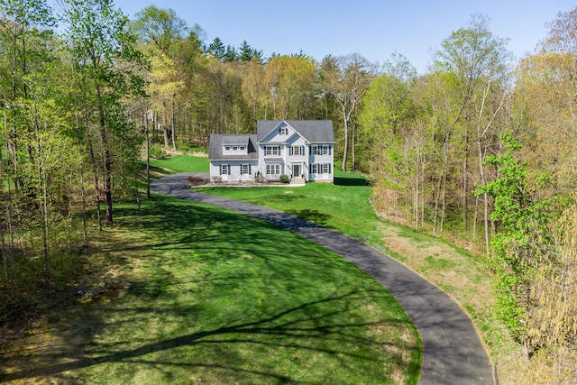 aerial view with a wooded view