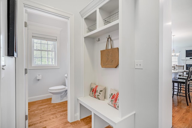 mudroom with light wood-type flooring and baseboards