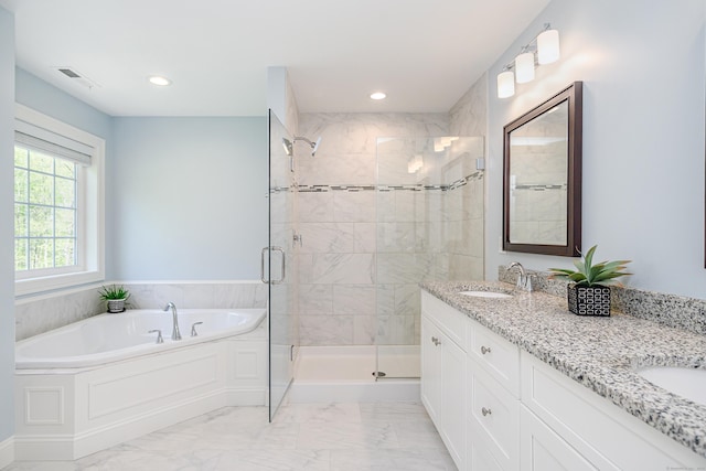 bathroom with a sink, marble finish floor, recessed lighting, a garden tub, and a stall shower