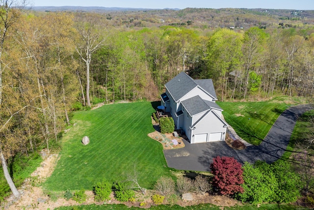 bird's eye view featuring a forest view