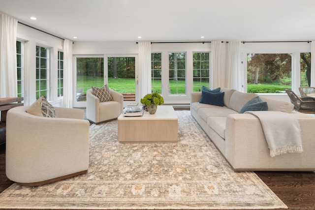 living area with wood finished floors and recessed lighting