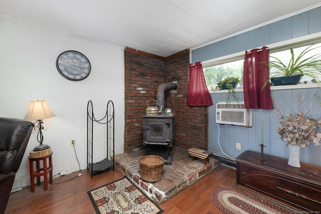 200 Mechanic St, Killingly, CT 06239 - living room with wood finished floors, a wood stove, ornamental molding, and cooling unit