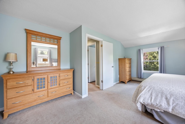carpeted bedroom with baseboards, a baseboard radiator, and lofted ceiling