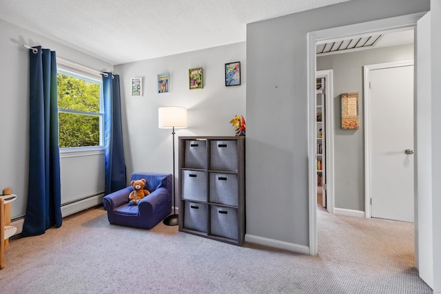 bedroom featuring carpet, a baseboard heating unit, and baseboards