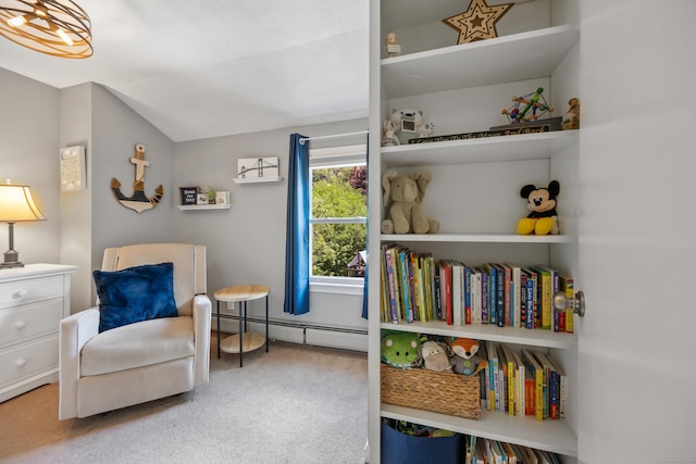 sitting room featuring carpet, a baseboard radiator, and vaulted ceiling