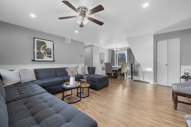 living area featuring visible vents, a ceiling fan, light wood-style floors, and recessed lighting