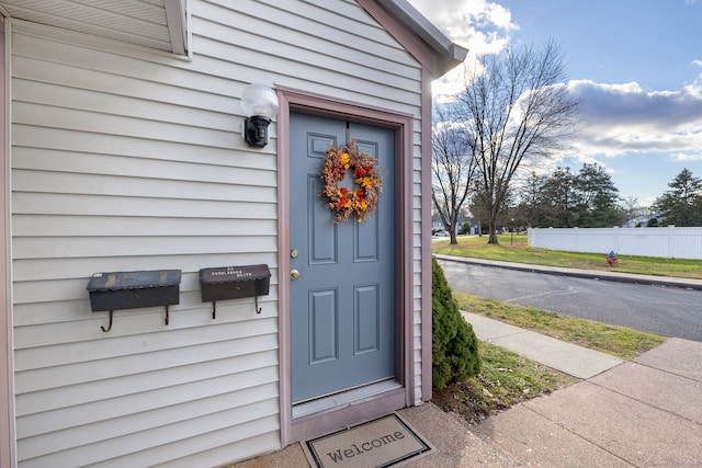 property entrance featuring fence