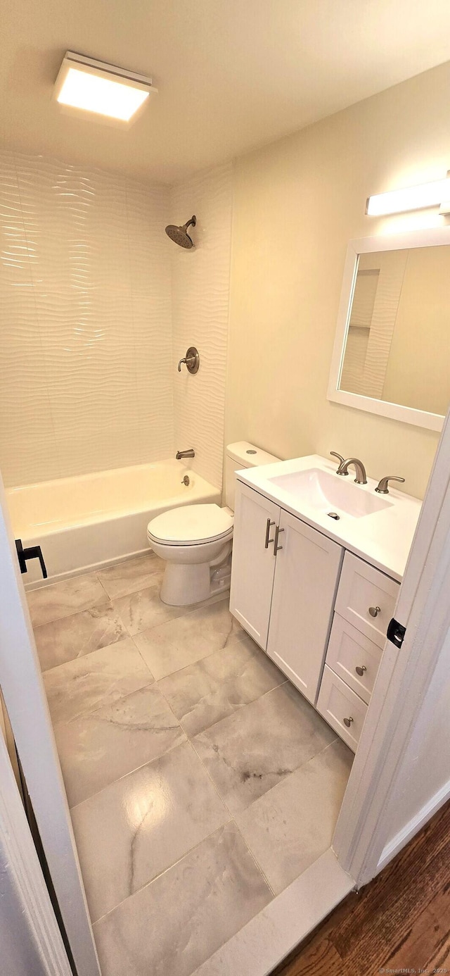 full bathroom with vanity,  shower combination, marble finish floor, and toilet