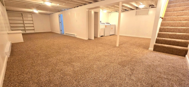 finished basement featuring carpet flooring, baseboards, stairway, separate washer and dryer, and a baseboard radiator