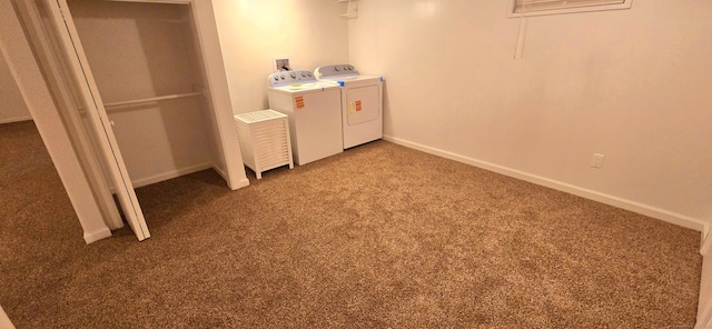 laundry area with baseboards, carpet flooring, and independent washer and dryer